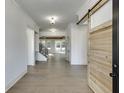 Inviting foyer with hardwood floors, complemented by a view of an elegant staircase and bright, open living spaces at 2427 Wolf Meadow Ln, Buford, GA 30518