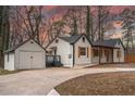 Charming single-story home with a detached garage and a landscaped front yard at 500 Pomona Sw Cir, Atlanta, GA 30315