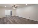 Bright and spacious living room featuring modern gray flooring and recessed lighting at 500 Pomona Sw Cir, Atlanta, GA 30315