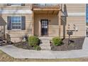 Inviting front entrance with landscaped garden beds and sidewalk at 1391 Old Coach Sw Rd, Marietta, GA 30008