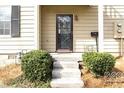 Close up of the front door with small garden beds leading up to it at 1391 Old Coach Sw Rd, Marietta, GA 30008