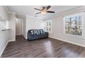 Cozy living room with hardwood floors, modern paint, and bright windows at 1391 Old Coach Sw Rd, Marietta, GA 30008