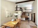 Inviting dining area boasting high ceilings, a wooden table and a staircase at 3150 Bolero Dr, Atlanta, GA 30341