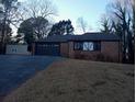 Lovely single-story home featuring a side-entry garage and neatly kept front lawn at 9031 Thornton Rd, Jonesboro, GA 30236