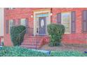 Charming brick home with a welcoming front porch and well-maintained landscaping at 420 Woodbrook Way, Lawrenceville, GA 30043