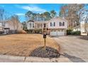 Charming two-story home with a two-car garage and mature landscaping at 1117 Mountain Springs Nw Dr, Kennesaw, GA 30144