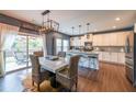 Eat-in kitchen area with stainless steel appliances, granite counters, and backyard access at 1935 Azure Grove Ct, Marietta, GA 30008