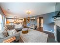 Spacious living room featuring hardwood flooring, a fireplace, and ample seating at 1935 Azure Grove Ct, Marietta, GA 30008