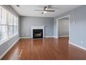 Bright living room featuring hardwood floors, a fireplace, and an ample natural light at 79 Greystone Way, Hiram, GA 30141