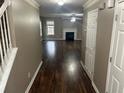 Inviting entryway leading to the spacious living room featuring hardwood floors and a fireplace at 3999 Riverside Pkwy, Decatur, GA 30034