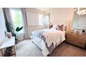 Cozy bedroom with plush bedding, soft lighting, and stylish decor at 127 Silvia Ln # 25, Hapeville, GA 30354