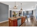 Gourmet kitchen with granite countertops, stainless steel appliances, and an island at 360 Chambers St # 301, Woodstock, GA 30188