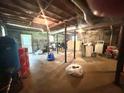 Unfinished basement with exposed ceiling, concrete floor, and visible utility connections at 1091 Summer Lake Rd, Lithia Springs, GA 30122