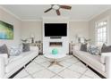 Open living room featuring a modern fireplace, white couches and decor at 16 Ramsey St, Roswell, GA 30075