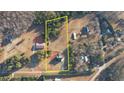 Aerial view of large lot with home, surrounded by mature trees at 4180 Mount Paran Dr, Social Circle, GA 30025