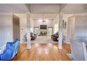Open-concept living room with hardwood floors, fireplace and vaulted ceiling at 4180 Mount Paran Dr, Social Circle, GA 30025