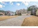 Beautiful two-story home with three-car garage and long driveway at 1050 Silver Thorne Dr, Loganville, GA 30052