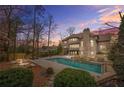 Backyard with a beautiful pool and lounge area, perfect for outdoor entertaining at 2373 Greenglade Ne Rd, Atlanta, GA 30345