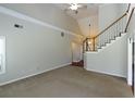 Spacious living room with vaulted ceiling, ceiling fan and view to the 2nd story landing at 3641 Willow Club Dr, Loganville, GA 30052