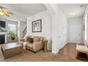 Comfortable living room with hardwood floors, neutral paint, and large window at 5152 Rapahoe Trl, Atlanta, GA 30349