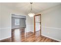 Elegant dining area with beautiful wood floors and a view into the Gathering room at 2270 Old Concord Se Dr, Covington, GA 30016