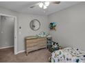 Cozy bedroom with neutral walls, plush carpet, and a window with natural light at 4804 Mceachern Way, Powder Springs, GA 30127