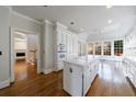 Bright kitchen featuring white cabinetry, a center island, stainless appliances, and a large window for natural light at 2650 Peachtree Battle Nw Pl, Atlanta, GA 30327