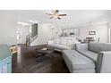 Open-concept living room featuring hardwood floors and plenty of natural light at 2066 Charcoal Ives Rd, Lawrenceville, GA 30045