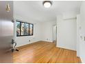 Bright and airy living room with hardwood floors and a large window at 323 3Rd Ne St # 5, Atlanta, GA 30308