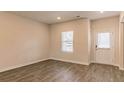 Bright open-concept living room featuring natural light and sleek flooring at 412 Barley Lot 86 Ct, Covington, GA 30014