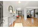 Inviting foyer with gleaming hardwood floors and a stylish console table at 310 Nw Brightfield Dr, Loganville, GA 30052