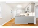 Bright kitchen featuring stainless steel appliances, white cabinets, and quartz countertops at 430 Lindbergh Ne Dr # M1, Atlanta, GA 30305