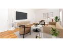 Living room featuring stylish furniture, a large TV, and ample natural light at 430 Lindbergh Ne Dr # M1, Atlanta, GA 30305