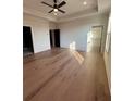 Spacious main bedroom features hardwood floors, a ceiling fan, and ample natural light at 110 Chiswick Cir # 40, Alpharetta, GA 30009