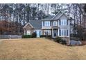 Beautiful two-story home with stone accents and lush landscaping at 5690 Stonekirk Nw Pl, Acworth, GA 30101