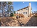 Spacious backyard features a wooden deck with stairs and a privacy fence at 849 Kirsten Jane Ct, Lawrenceville, GA 30045