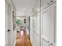 Hallway with hardwood floors and white cabinet storage on one side of the wall at 2769 Peachtree Ne Rd # 4, Atlanta, GA 30305