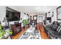 Spacious living room featuring hardwood floors, stylish decor, and a comfortable seating area at 2870 Pharr Court S Nw # 2006, Atlanta, GA 30305