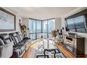Modern living room with city views, floor-to-ceiling windows, and elegant furnishings at 2870 Pharr Court S Nw # 2006, Atlanta, GA 30305