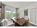 Bright home office with a view, custom shelving, and French doors at 313 Canoe Pl, Villa Rica, GA 30180