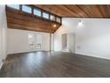 Spacious living room featuring vaulted wood ceilings, new flooring, and abundant natural light at 4962 Preswick Ne Ct, Marietta, GA 30066