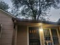 Front entrance with security door and charming window at 1767 Thomas St, Decatur, GA 30032