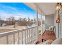 Inviting front porch with railing offering a view of the neighborhood at 182 Noah Dr, Rockmart, GA 30153