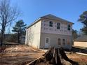 New two-story home featuring gray siding, a rear entrance, and bright windows at 4862 Campbell Dr, Atlanta, GA 30349