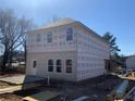 New two-story home featuring gray siding, a rear entrance, and bright windows at 4862 Campbell Dr, Atlanta, GA 30349