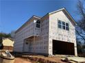 New two-story home under construction with siding, garage, and bright windows at 4862 Campbell Dr, Atlanta, GA 30349