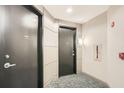 Hallway view of unit doors with carpet flooring and neutral colored walls at 2626 Peachtree Nw Rd # 804, Atlanta, GA 30305
