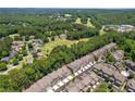 Scenic aerial view of a residential community surrounded by lush greenery and golf course at 226 Trecastle Sq # 23, Canton, GA 30114