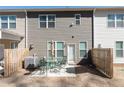 Cozy backyard featuring a patio with a dining set and privacy fence at 2882 Cadence Walk Rd, Atlanta, GA 30360