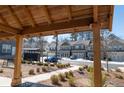 Community area featuring manicured lawns, walking path and bench seating at 2882 Cadence Walk Rd, Atlanta, GA 30360